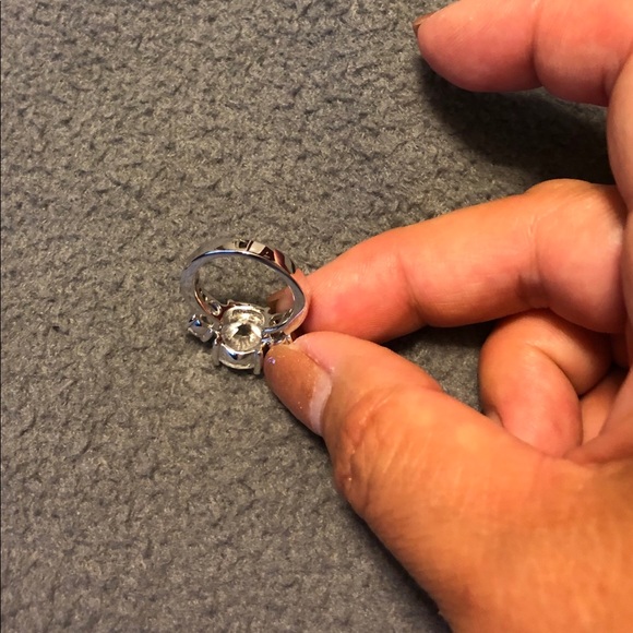 CZ 3 stone ring mounted on silver tone setting. - Picture 7 of 8